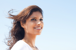 woman smiling with hair blowing